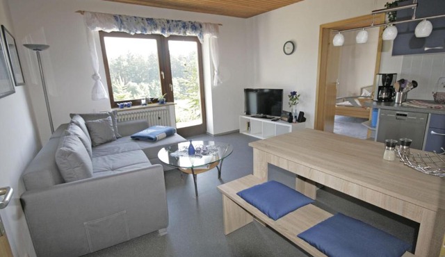Cosy apartment with terrace and garden access in a quiet wooded area