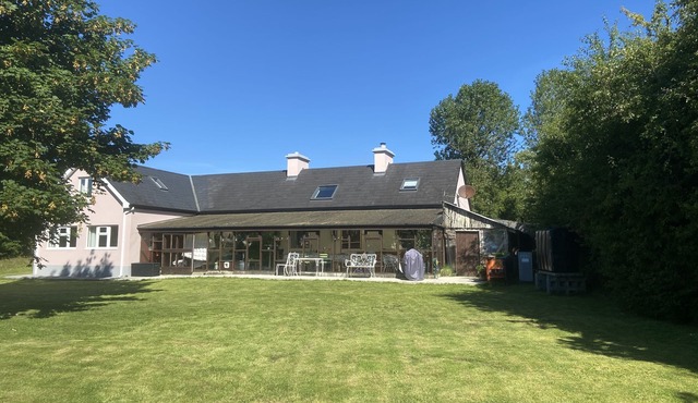 Cottage in a rural setting with large conservatory.