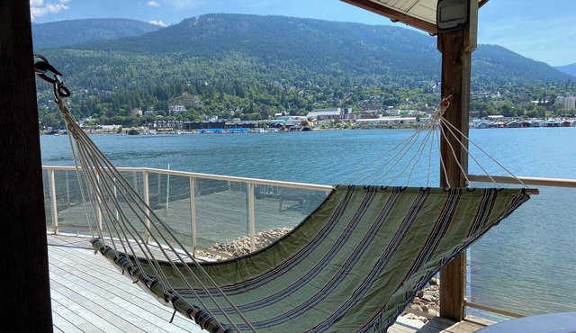 Cottage on a private sandy beach with a gorgeous view of the city of Nelson.