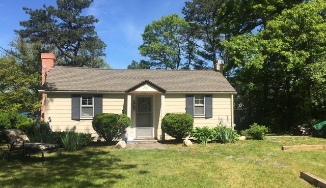 Cozy Cape Cod cottage overlooking Jenkins Pond; with private beach & dock.