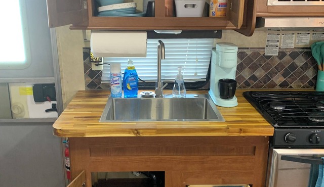 Cozy Family RV in charming Grand Saline with AC, WiFi, and triple Bunk bed.