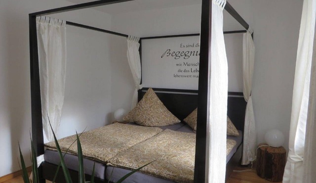 Cozy vacation apartment (80 m2) with wooden terrace and sunbathing lawn