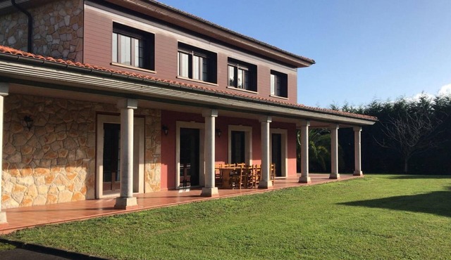 Detached house with large garden, perfect for families.