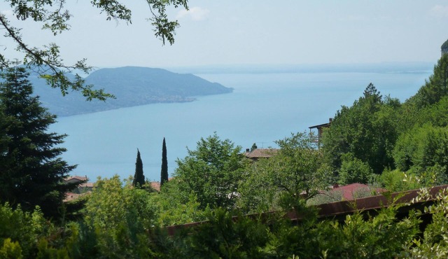Detached sunny holiday house with lake and mountain views, pool, pellet stove