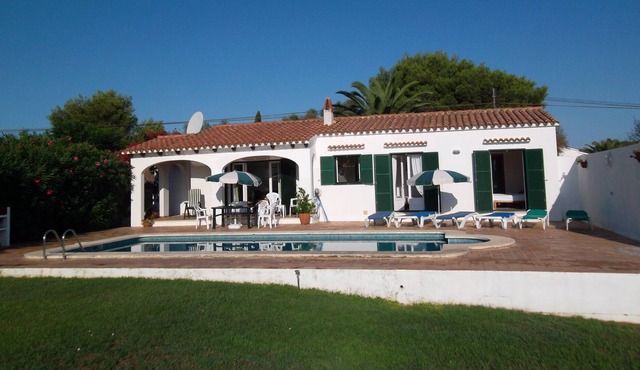 Detached villa with private swimming pool in landscaped gardens.