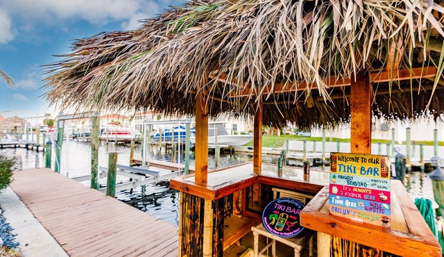 Direct gulf access home with heated SALT pool, tikibar, game room, and boat lift