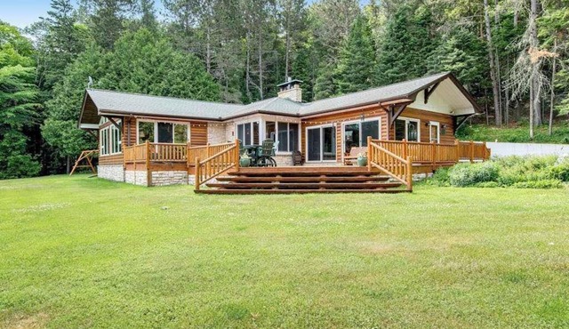 Dog-friendly and secluded lakefront gem with a full bar, private dock, and views