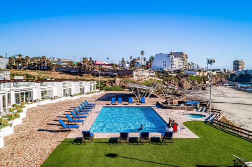 Dog-Friendly Beachfront Retreat with Rooftop Deck, Pool, Hot Tub, & Kitchen