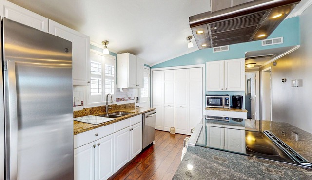 Dog-friendly home near the beach with private hot tub & covered porch
