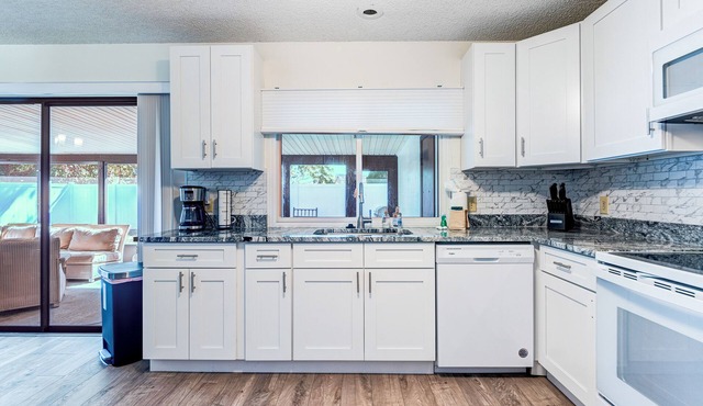 Dog-friendly home with fenced yard & screened patio - near beach & Dodgertown
