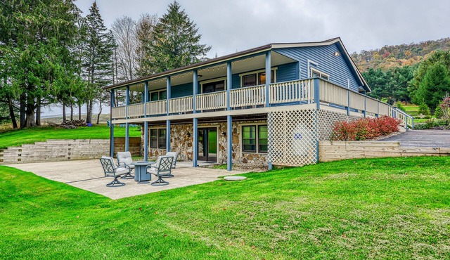 Dog-friendly home with private pond, wraparound porch & fireplaces