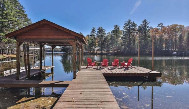 Dog-friendly, lakefront lodge in the woods with large dock, central AC, & canoe