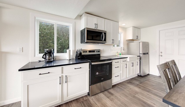Dog-friendly oceanfront retreat with hot tub & relaxing deck facing the water