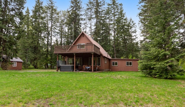 Dog-friendly riverfront home with hot tub, large yard, and fast Wifi