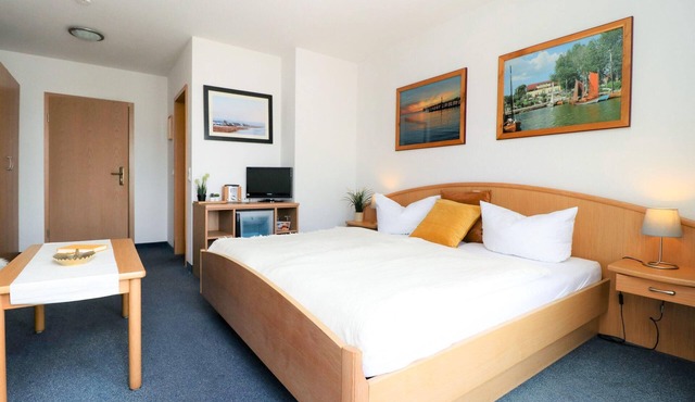 Double room with balcony directly at the harbor of Wustrow