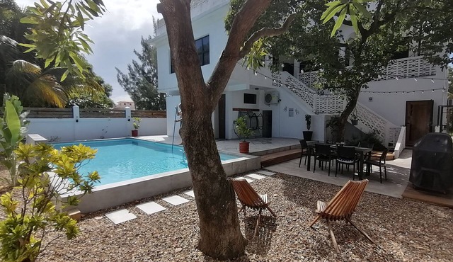 Downtown Dangriga! Style and comfort with a pool. Maya Mountains and sea views.