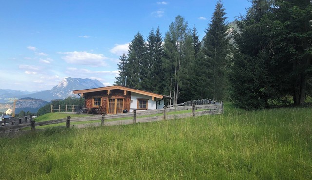 Dreamlike mountain hut with large garden