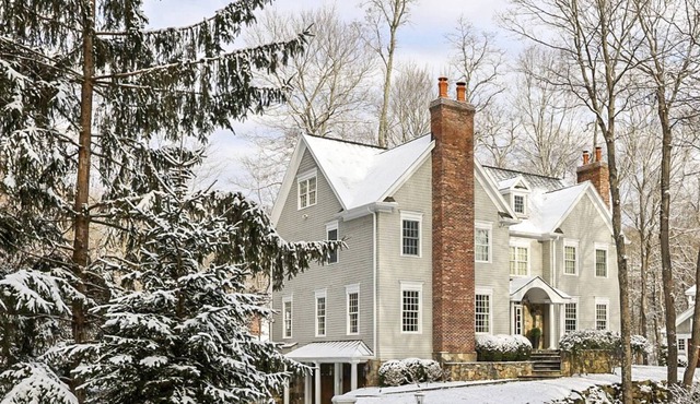 Elegant, spacious escape nestled in the trees with home theater, huge gym