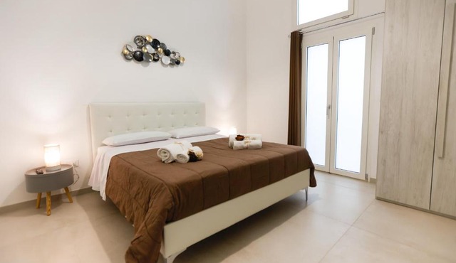 Elegante Bilocale con Giardino
