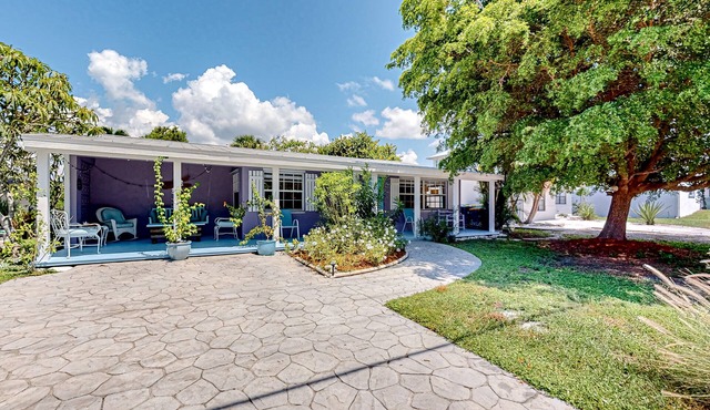 Enchanting dog-friendly beach bungalow with patio, fireplace, deck, AC, & W/D