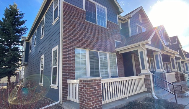 End-unit townhome with garage, patio, and office, near shopping and trails!