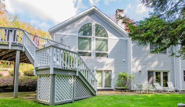 Enjoy the calming views of the woods at "Treeside" in Eagles Mere