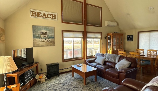 Enjoy waterview with Pond access; min to beach! Large deck for dining & sunsets!