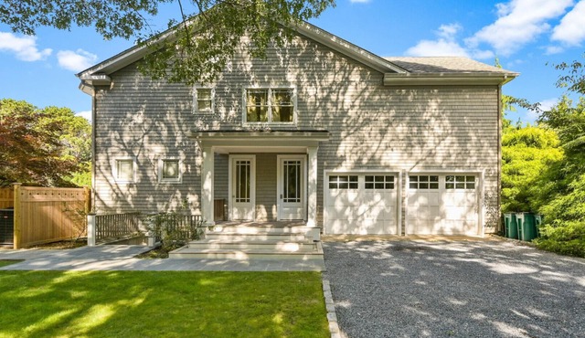 Exceptional shingle-style home sited on just under an acre of land,.
