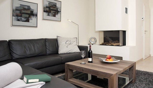 Exclusive 5-star vacation apartment in a top location, with sauna, fireplace & large balcony.