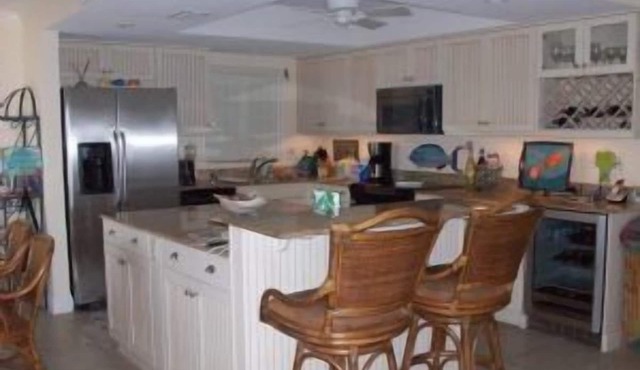 Exclusive third floor three bedroom three bath end condo!