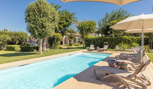 Exclusive villa with swimming pool surrounded by greenery