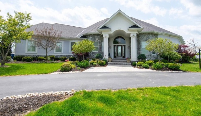 Executive home on acreage and on a golf course.