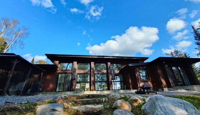 Expansive Lakefront modern retreat nestled by nature, huge windows ,4 bedroom