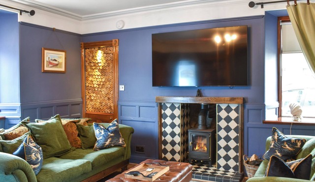 Experience cosy comfort in this Cairnbulg holiday home, featuring a log fire.