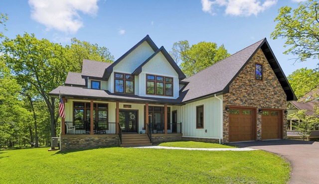 Experience luxury at 'Somewhere Only We Know' in Stillwater with stunning lake views!