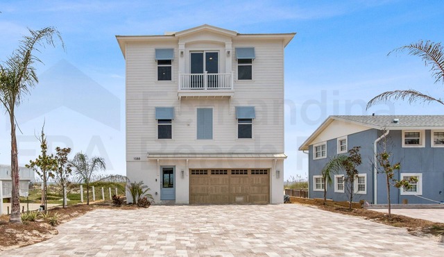 Experience oceanfront luxury at 1088 S. Fletcher Ave, a spacious 5-bedroom house
