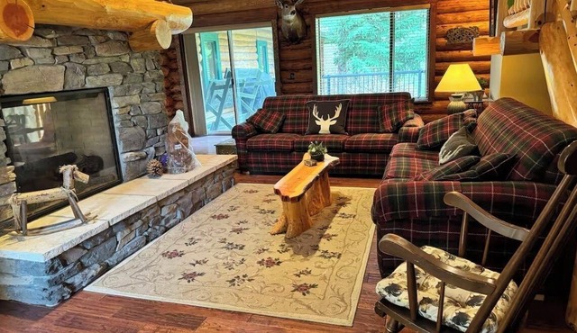 Experience the warmth of our gorgeous log home backing onto the first fairway.