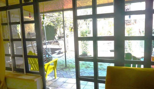 Experience tranquility in the center of the city. Enjoy a private garden.