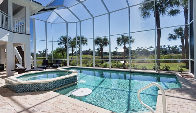Exquisite river-view home with heated pool and spa in the expansive lanai