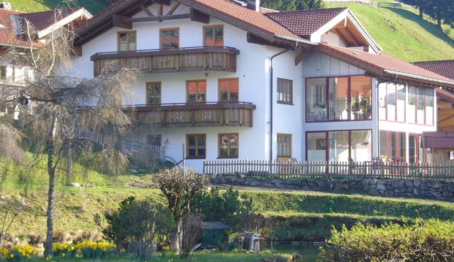 Family-friendly vacation apartment by the water with terrace and own playground