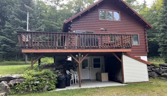 Fantastic Lakefront Wooden Cabin Settled Between Trees in Stratton, Vermont