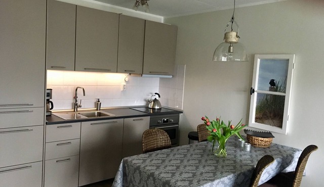 First floor apartment with south-facing terrace approx. 200 m to the beach