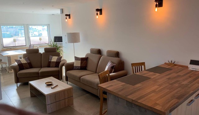 First floor vacation apartment on approx. 78 sqm, high-quality and modern furnishings with furnished terrace with garden pond and barbecue facilities, covered e-bike charging station and lockable bicycle room. You can look forward to: a fully equipped.
