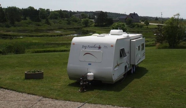 Fully equipped camper on Mavillette River. Close to the beach. (pet friendly)