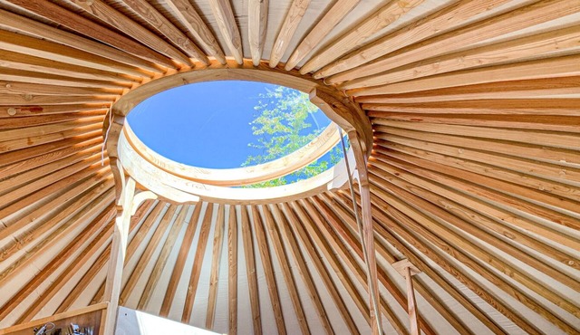 Fully equipped "Kilimanjaro" ethnic yurt near a large lake.