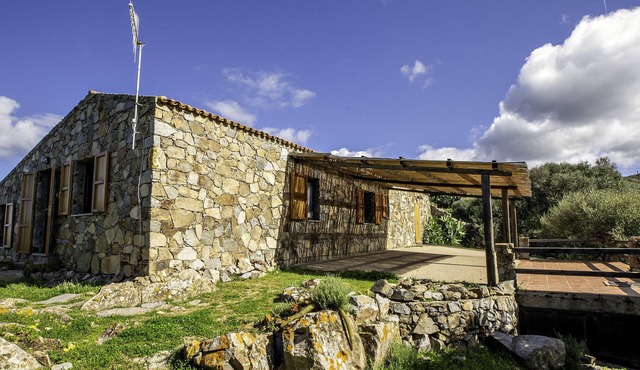 Gallurese stazzu in the countryside with sea view above Li Feruli