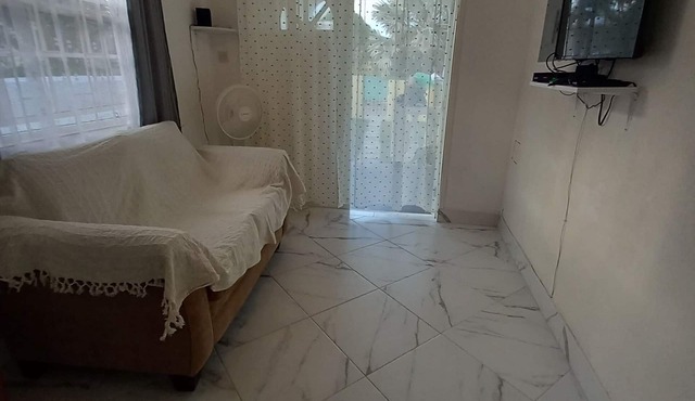 Garden Apartment modern clean and well kept, comfortable cool burglar bars nets