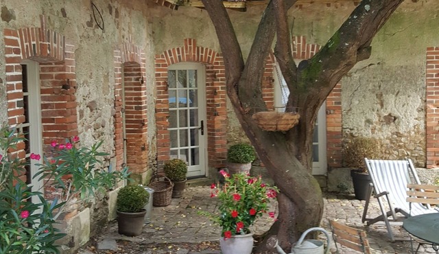 Gite with shaded paved terrace
