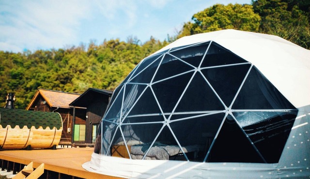 Glamping dome tent bathed in the setting sun in Se/Onomichi Hiroshima