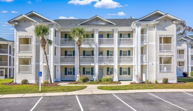 Golf Course Condo in Myrtle Beach with a pool view and River Oaks Golf Course